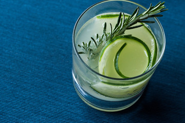 Rosemary Gin Gimlet Cocktail with Cucumber Slice.