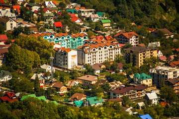 Image above buildings at foot of mountains