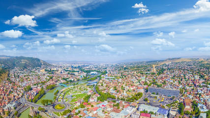 Sunny day with blue sky and white clouds in Tbilisi, Georgia