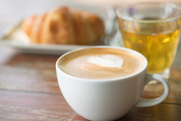 Coffee, drinks, coffee and cake on a wooden table, breakfast