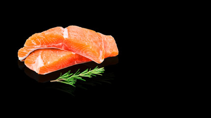 Salmon fillet  and herbs isolated on black background