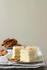 Pieces of apple cake and dried apples on a wooden table. Rustic style.