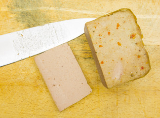 Baked pate on a wooden board. View from above.
