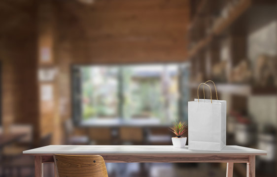 Mock up wooden table with white paper bag for product display