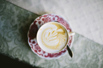Coffee latte in a vintage cup