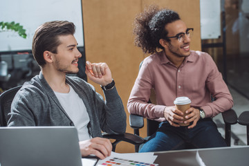 young creative designers in conference hall at modern office