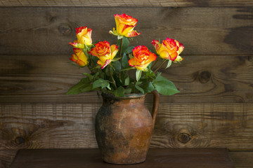 orange roses in a vase