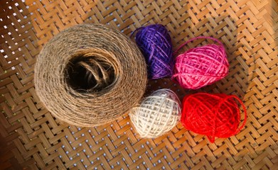 Colorful Knitting wool on wood background