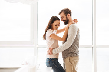 Pretty young couple embracing