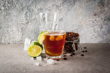 Espresso Tonic, refreshment summer drink with tonic water, lime and coffee, grey stone table, copy...