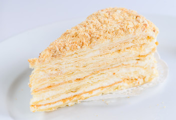 Slice of sweet classic layered cake Napoleon for background