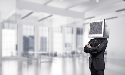 Businessman with monitor instead of head.