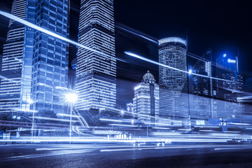 Blurred traffic light trails on road