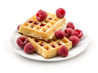 Traditional waffle (Belgian) with fresh raspberries on a saucer and honey isolated on white background two sweet delicate and airy delicious breakfast.