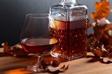 Brandy and dried up oak leaves .