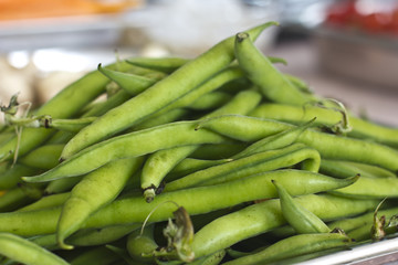 Green raw french beans close-up. Selective focus