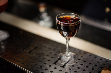 Little drop on the surface of the alcoholic cocktail