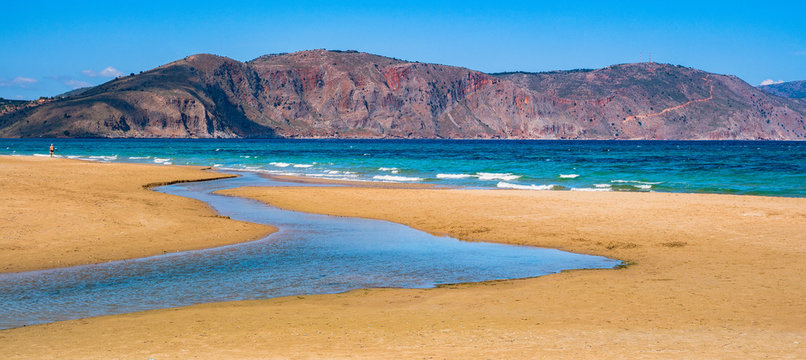 the river flows into the sea. the sea and the mountains. Georgioupolis, Crete, Greece