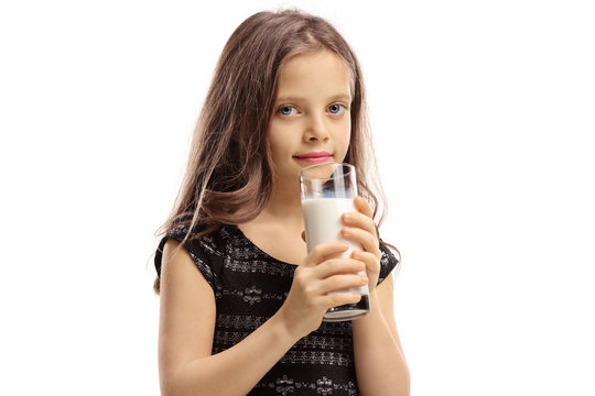 Little girl having a glass of milk