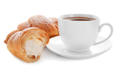 Tasty croissants with cream and cup of coffee on white background
