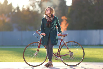 Hipster girl with vintage bicycle
