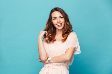Happy young lady over blue background.