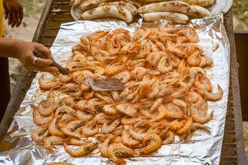 Mass of shrimp cooking on Grill with foil