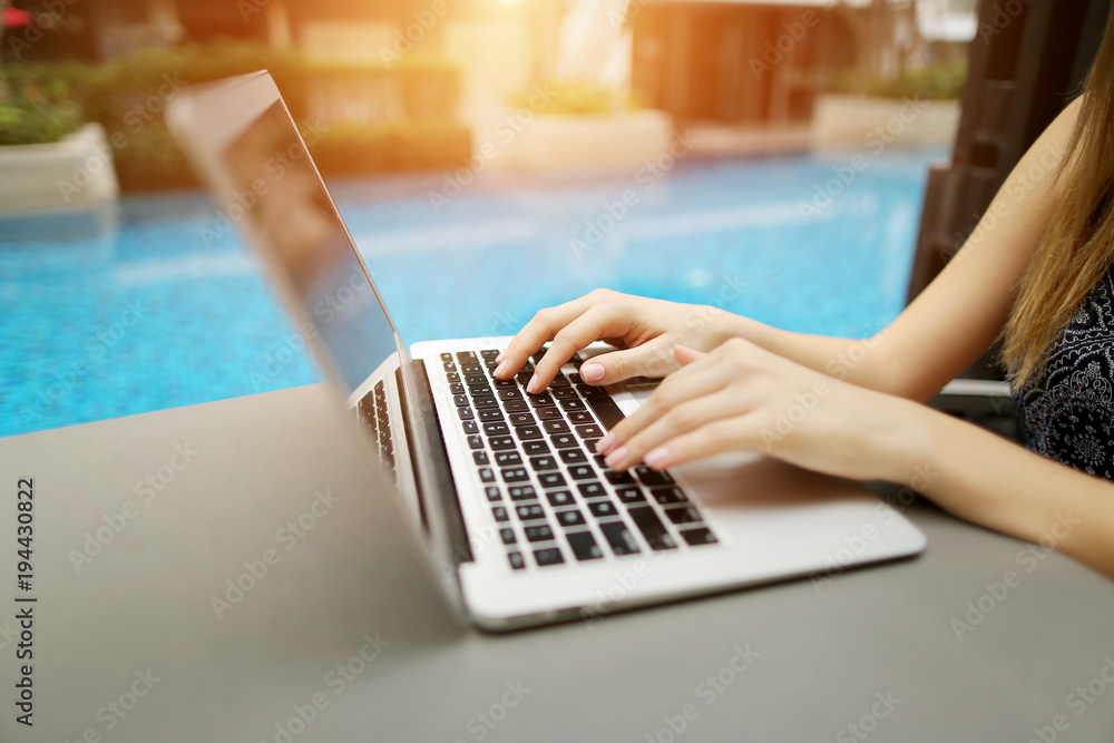 Canvas Prints fingers typing on the computer keyboard. close up portrait of woman hands pressing buttons on laptop