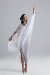 Naklejka premium Oriental princess belly dancing on grey