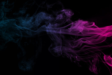 Abstract blue and pink smoke on a dark background.