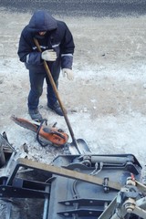 Working men in the form of standing around a sand pit  