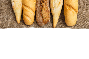 baguette of whole wheat bread on a white background