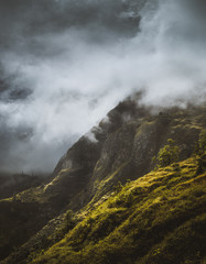 Stunning scenery with mist flowing over huge mountain slope and spilling into the green valley. Santo Antão Cape Verde Cabo Verde