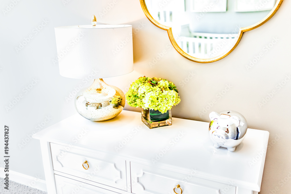 Poster closeup of modern light wooden chest drawer in bedroom with natural light in staging home, house apa