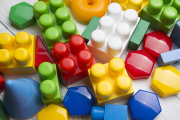 Kids educational developing toys frame on white background. Top view. Flat lay. Copy space for text