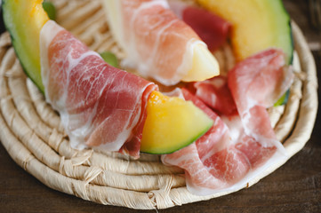 Cantaloupe melon and italian ham slices