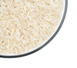 Healthy food. Glass bowl with parboiled rice on white background. Close up, top view, high resolution product.