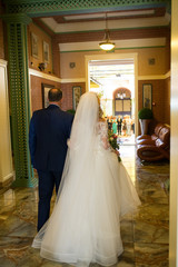 Father in a suit leads beautiful bride to the altar. Wedding ceremony