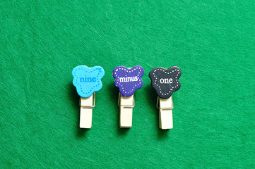 Nine minus one on a green background