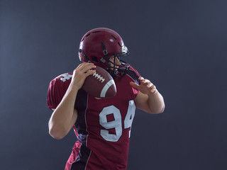 american football player throwing ball