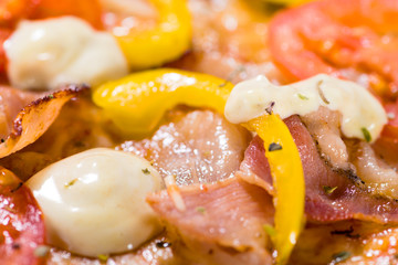 Food background with bacon and yellow pepper
