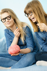 Two crazy women friends thinking