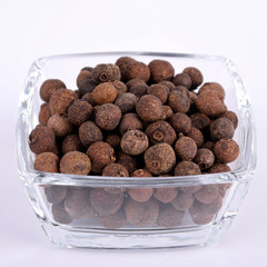  pepper peas fragrant in a glass bowl on a white background