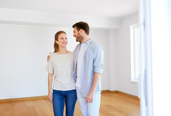 happy couple hugging at new home