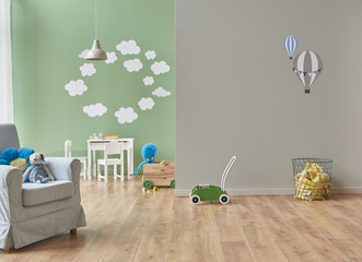 baby bedroom design modern green wall and grey parachute pattern. many toys in the room style.