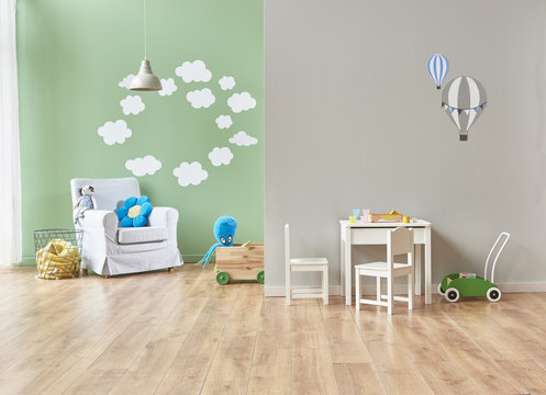 green and grey wall baby room with furnitures and toys interior.