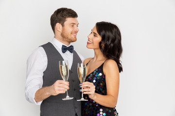 happy couple with champagne glasses at party