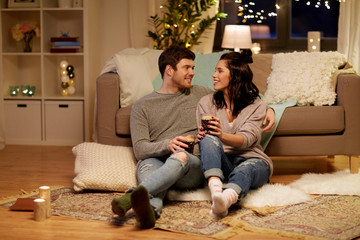 happy couple drinking coffee and eating at home
