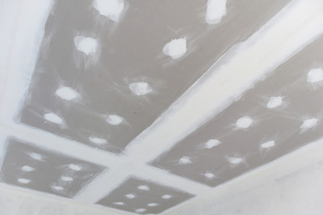 ceiling gypsum board installation at construction site