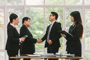Business people shaking hand when deal project done